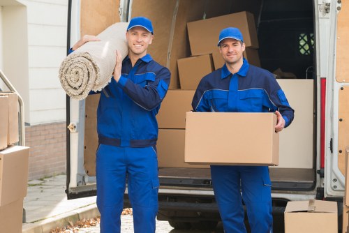 Man and van moving furniture in a Belgian city street