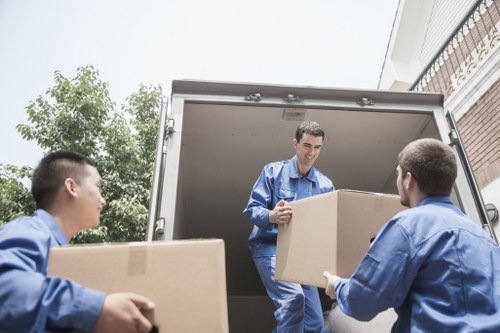 Local moving service preparing furniture and cartons for delivery across Belgium