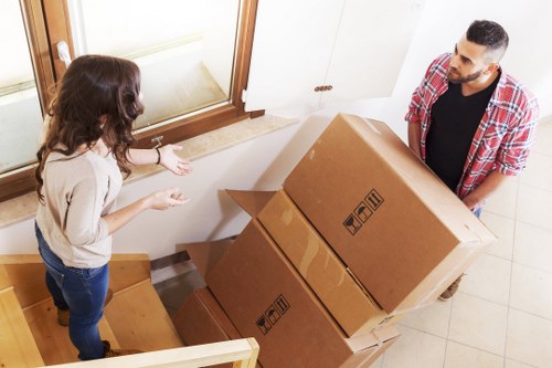Professional movers handling apartment access in Belgium
