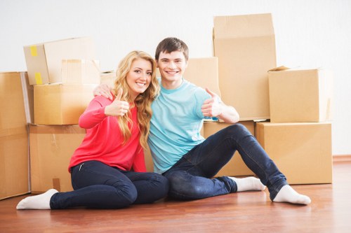 Packed moving boxes and household items ready for transport in Belgium