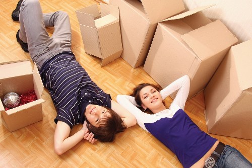 Family preparing boxes and essentials for a house move in Belgium