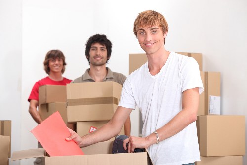 Local packing team handling fragile items during a move