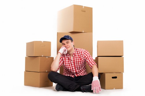 Furniture being carried through a narrow staircase during a home move